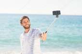 depositphotos76423677-stock-photo-happy-man-taking-selfie-w[...].jpg