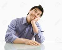 3569354-young-asian-business-man-sitting-daydreaming-.jpg
