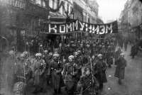 ArmedsoldierscarryabannerreadingCommunism,Nikolskayastreet,Moscow,October1917.jpg