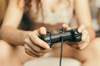 girl-out-focus-holding-joystick-600nw-431456878.jpg