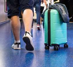 back-view-man-with-suitcase23-2148255964-3328590885.jpg
