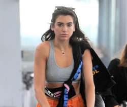 dua-lipa-at-heathrow-airport-heading-off-for-her-upcoming-t[...].jpg