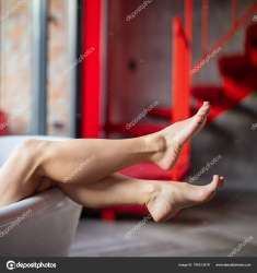 depositphotos795513478-stock-photo-woman-feet-bathrobe-hotel-room.jpg