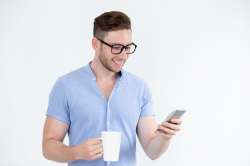 cheerful-intelligent-man-reading-message-phone1262-4738.jpg