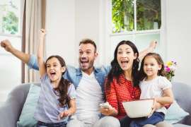 family-cheering-watching-tv-home-happy-68226903.jpg