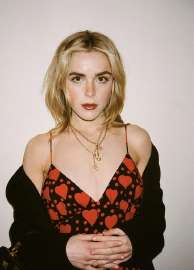 kiernna-shipka-wearing-a-saint-laurent-red-dress-v0-ytmxx0qr837f1.jpg