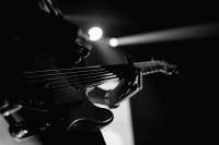 man-playing-electric-guitar-scal.png