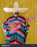 stock-photo-mexican-typical-man-with-poncho-and-sombrero-playing-guitar-79947868-2534516606.jpg