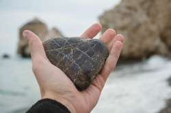 person-holding-heart-shaped-rock-his-hands-beach181624-44700.jpg