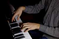 two-male-hands-on-the-piano-palms-lie-on-the-keys-and-play-[...].jpg