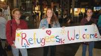 2015WellwishersWaitingforRefugees.webp