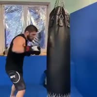 Khabib Nurmagomedov punching the heavy bag.mp4