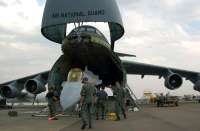 180625100634-c-5-galaxy-cargo-jet-loading-f-16-fighter-jet.jpg