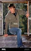 germany-bavaria-man-entering-through-window-smiling-C3PT3Y.jpg