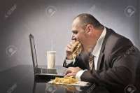 11571339-fat-businessman-eating-junk-food-in-front-of-a-laptop.jpg